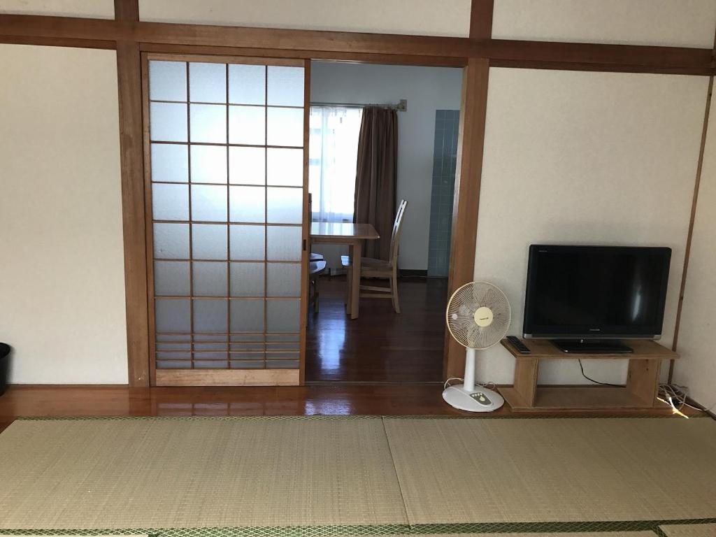 Golden Mile Apartment Amami Exterior foto